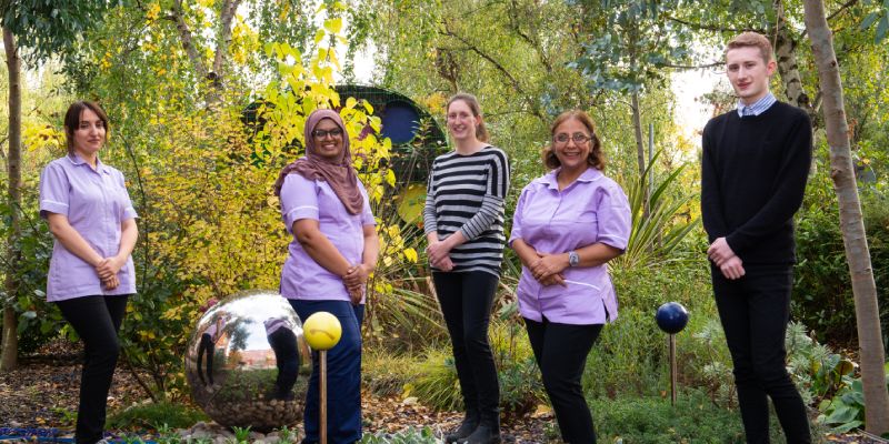 Stop smoking advisors outside in a garden.