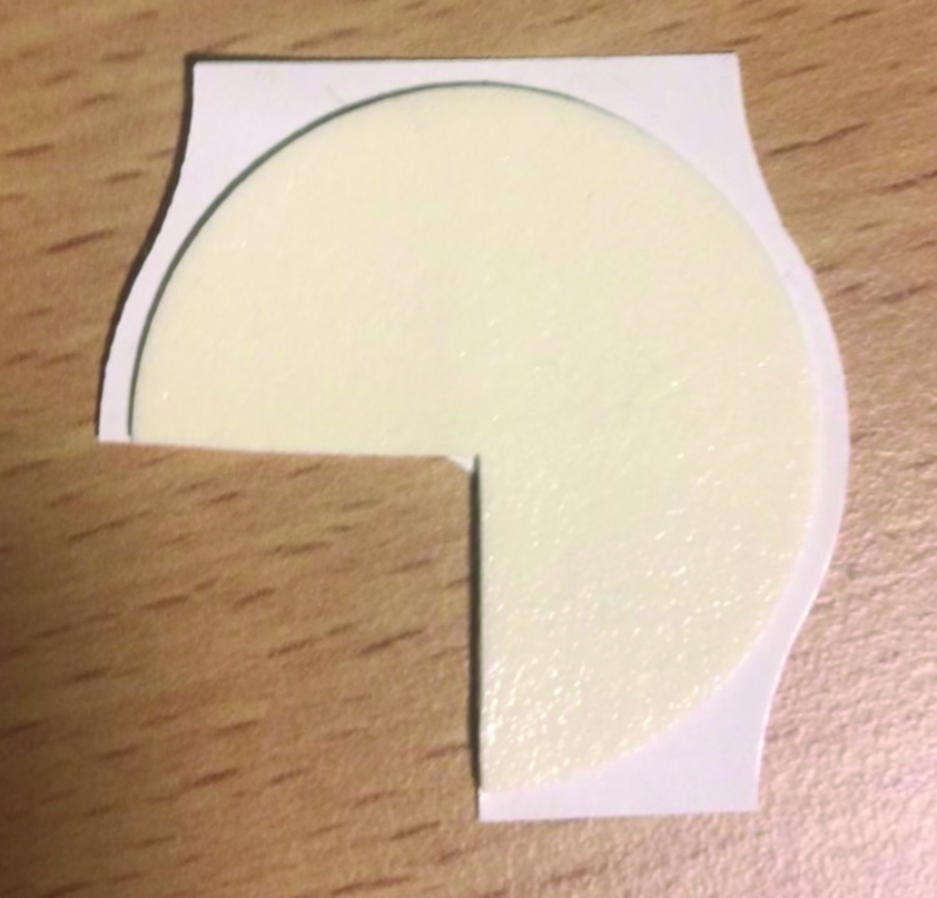 Photograph of the patch with one quarter of the cover patch removed