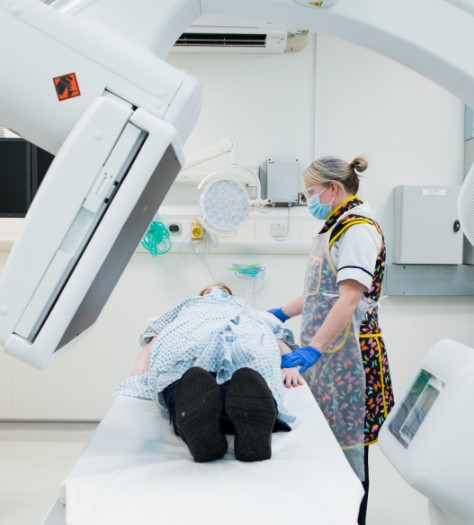 a patient receiving a fluoroscopy