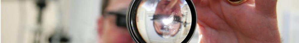 Optometrist with a lens