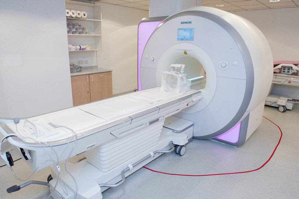 An MRI scanner showing an empty bed