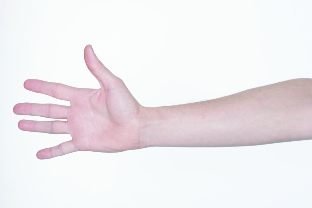 Photograph of a persons hand with fingers out stretched