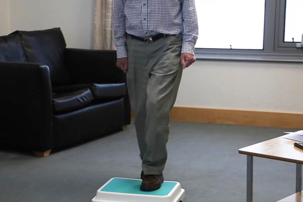 Photograph of a person doing step ups