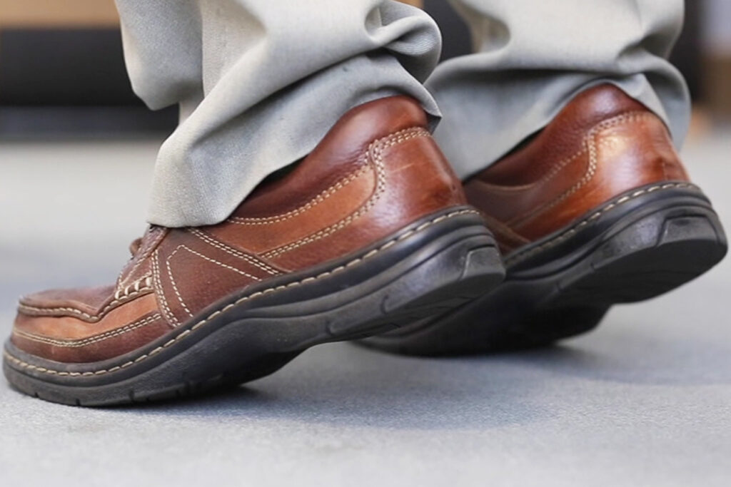 Photograph of a persons feet doing heel raises