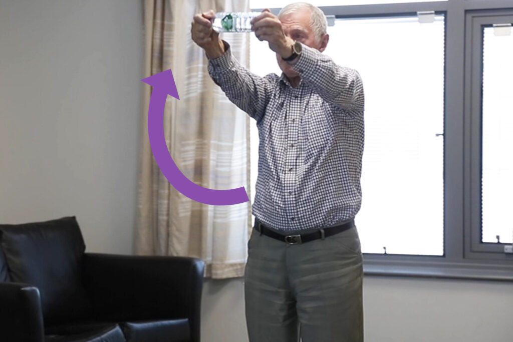 Photograph of a person doing double arm raises