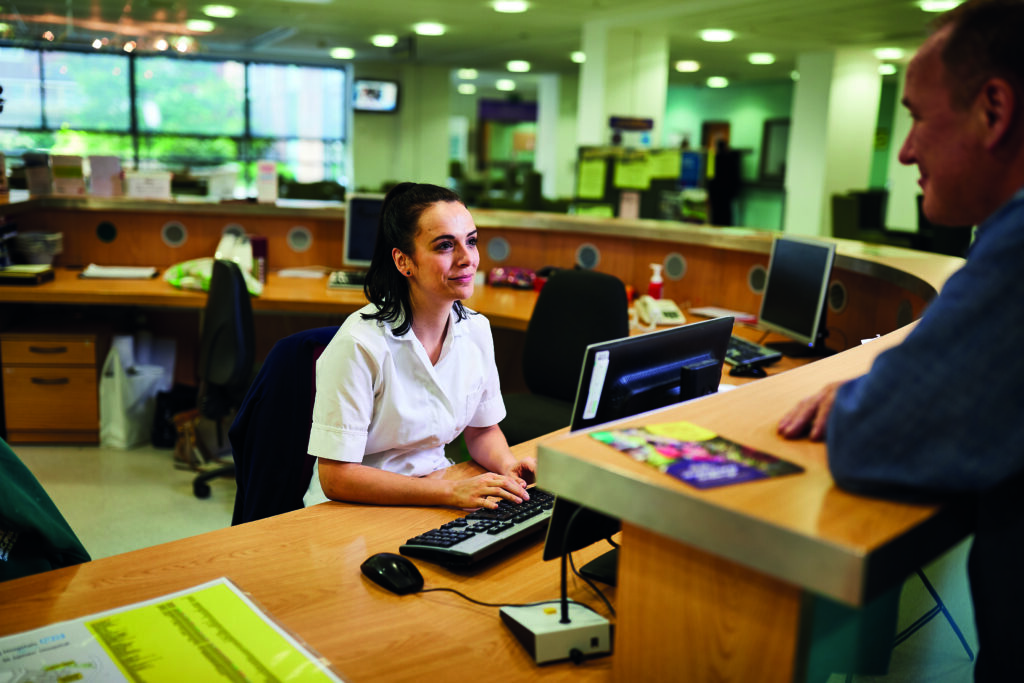 Photograph of the main reception desk.