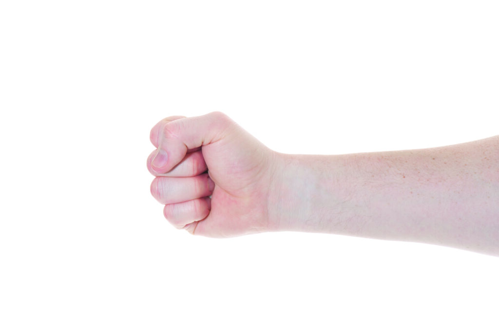 Photograph of a persons hand with fingers in a fist