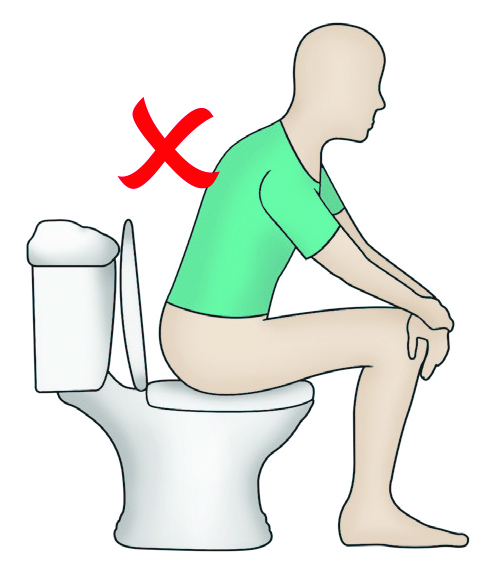 Image of a person sitting on a toilet incorrectly without a raised toilet seat.