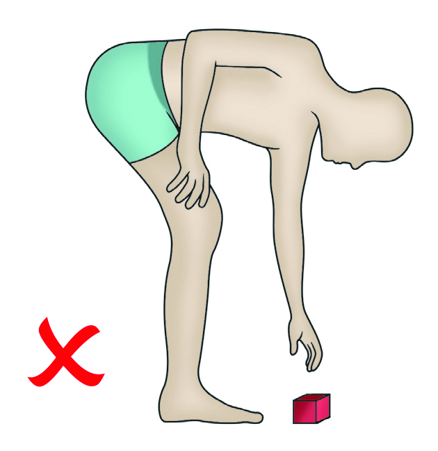 An image of a person bending down to reach an item on the floor. This action needs to be avoided. 
