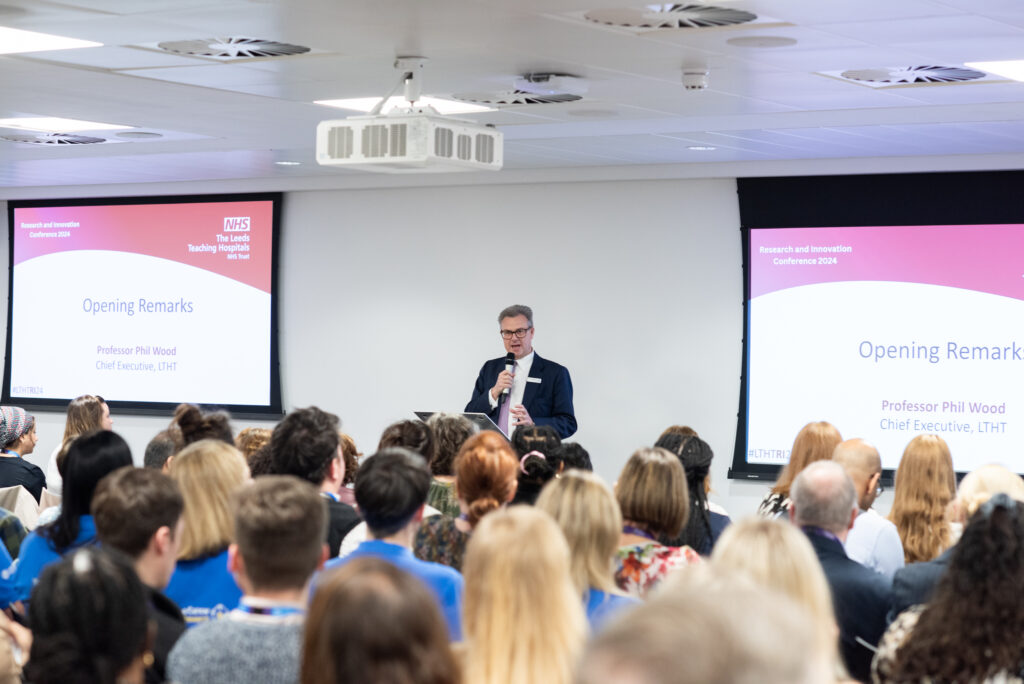 Professor Wood opening the conference with the audience watching.