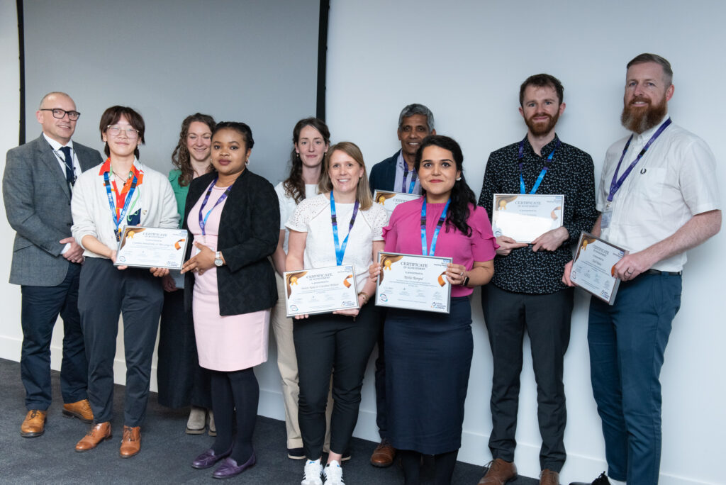A photo of the award winners with Dr Magnus Harrison standing on the right of the picture.