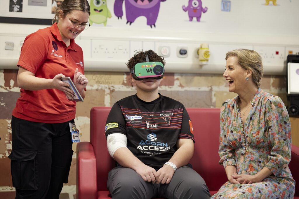 HRH The Duchess of Edinburgh with patient Brayden (13) and Play Specialist Lucy.