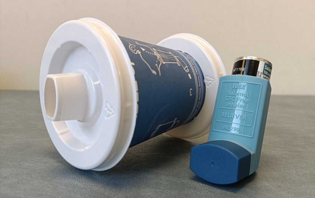 Photograph of a disposable spacer and an inhaler