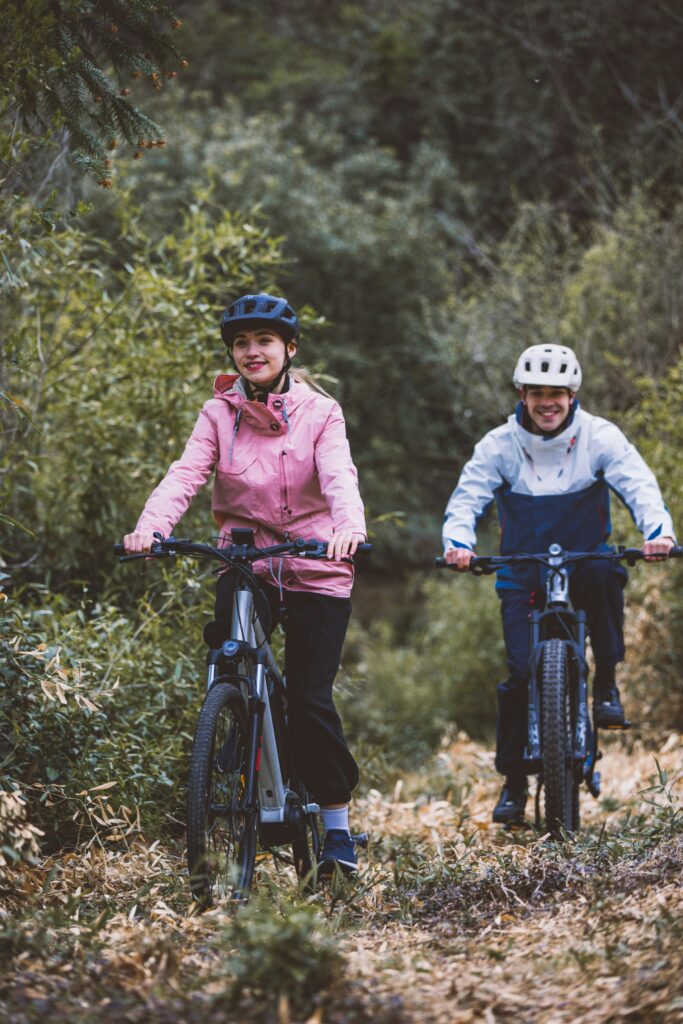 Photograph of two young people cycling