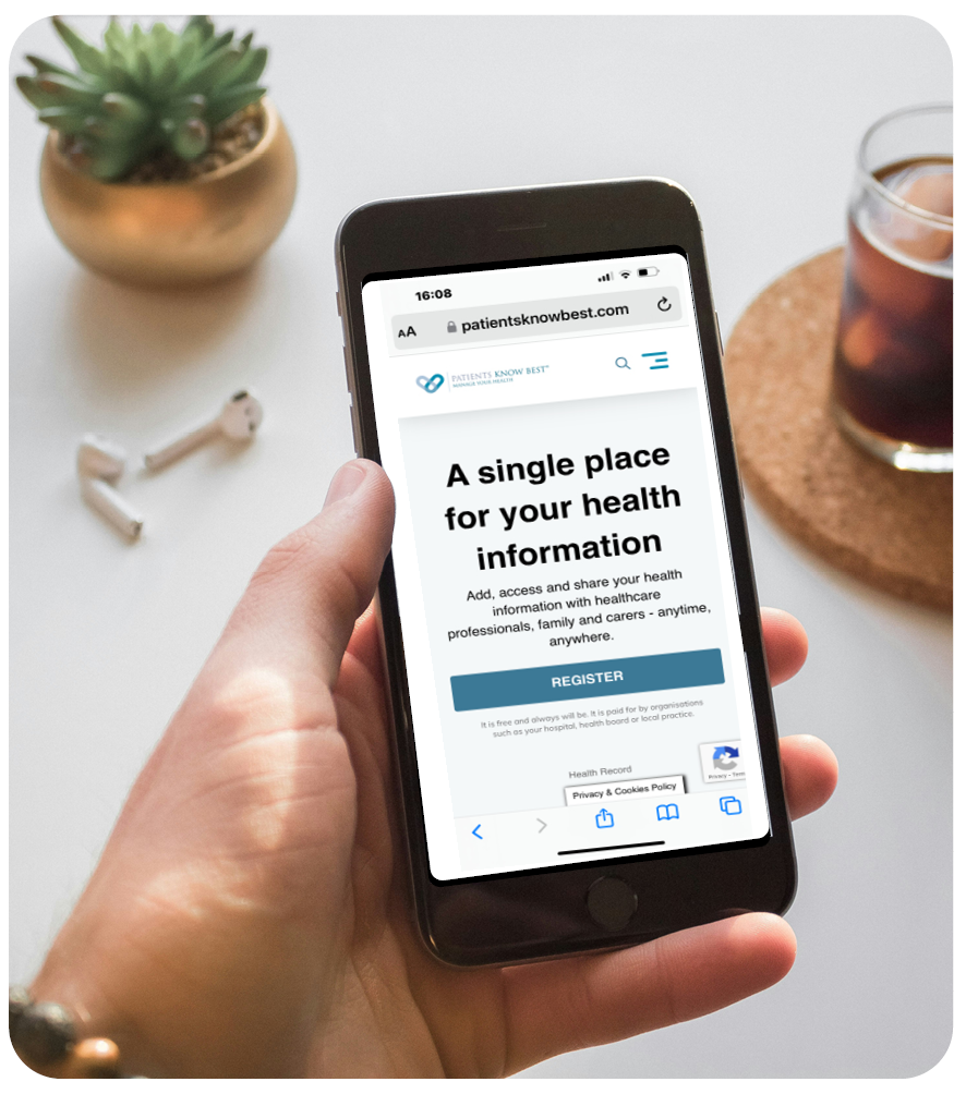 The photograph shows someone accessing the Patient Knows Best webpage on their phone