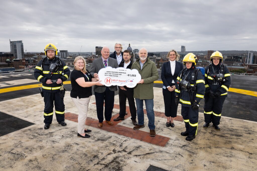 People including staff and visitors from the Help Appeal pictured on the Helideck with cheque being presented for &pound;61,063