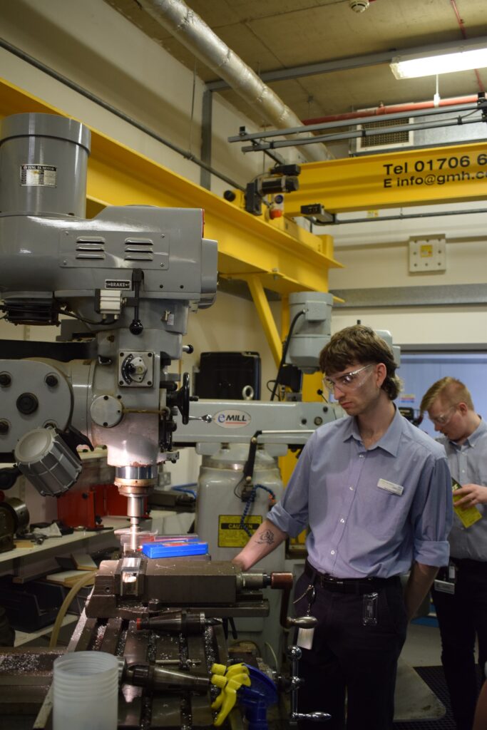 Lewis Collin, a medical engineering apprentice, working in the laboratory