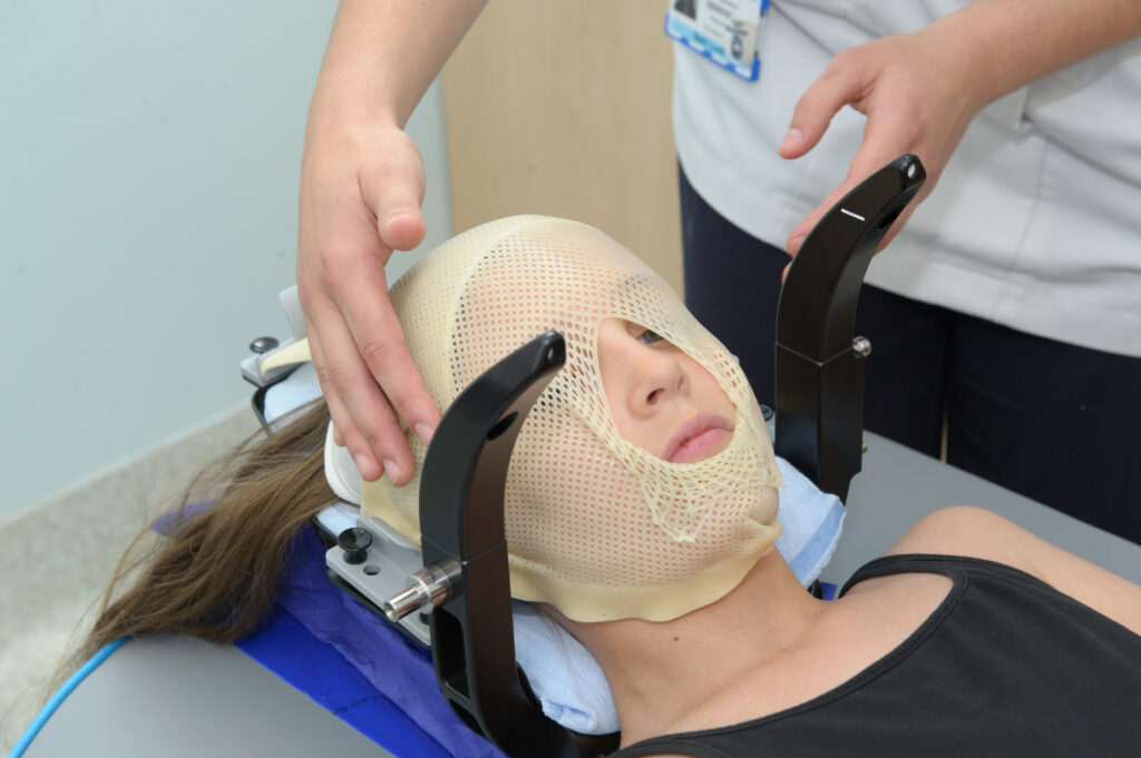 Photograph of a child in a immobilisation mask.