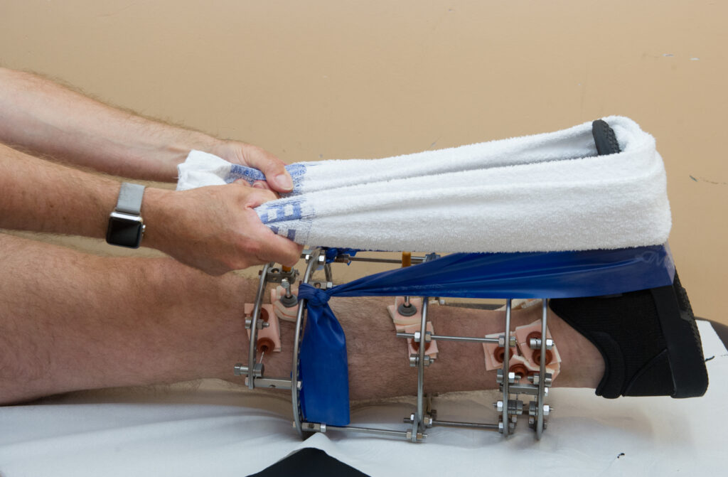 Photograph demonstrating Calf Stretch exercise.
Keeping your knee straight, place a towel around foot and pull toes towards you.
Hold for 30 seconds.