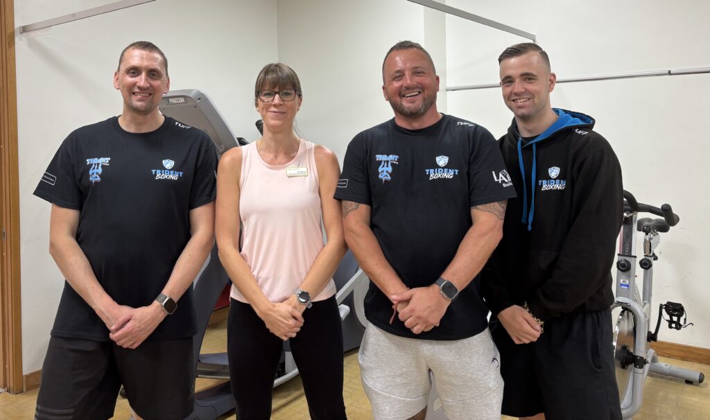 Group photo of Joe Gledhill (Director of Trident Fitness) Ally Whelan (Specialist Neurological Physiotherapists at Leeds Teaching Hospitals NHS Trust), Chris Walsh (Director of Trident Fitness) and Chris Halliday (Instructor for Trident Fitness).