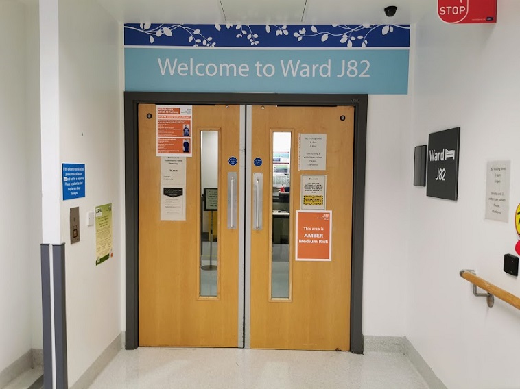 An image of double doors to the entrance to Ward J82.