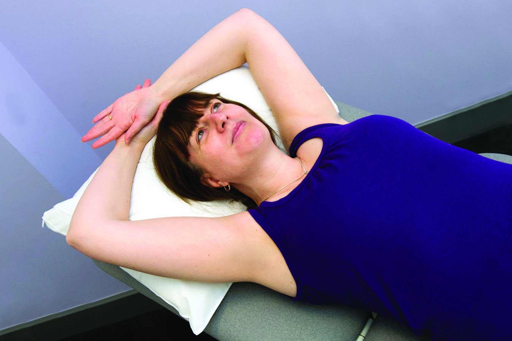 Exercising stretching not using an aid.