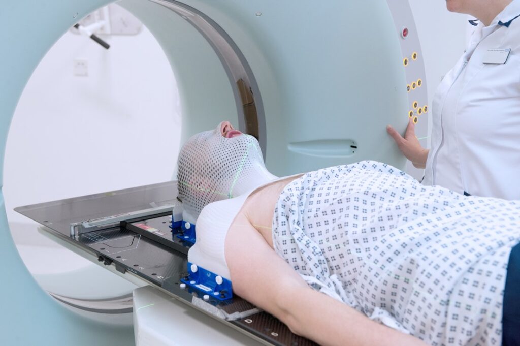 Patient in mask in the treatment position