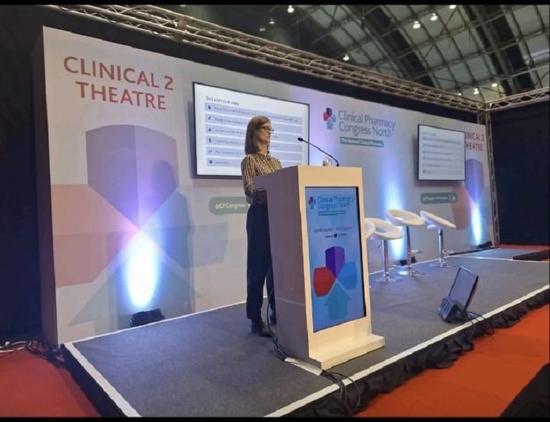 An image of Ruth Price from the InnoMeds Team at the Clinical Pharmacy Congress North speaking from a lectern.