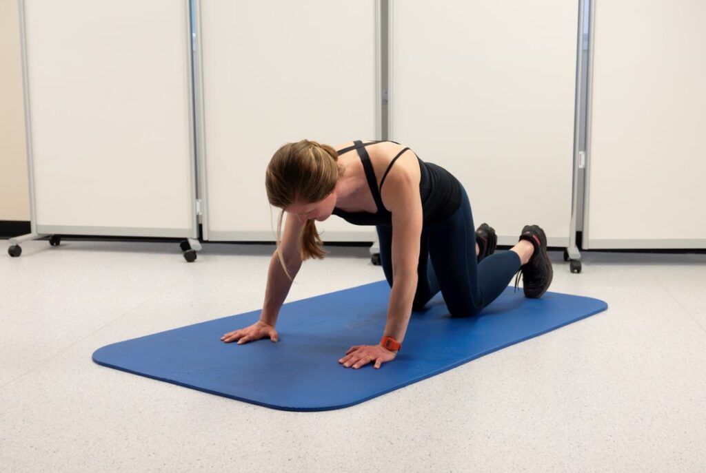 Gently transfer your weight from side to side, keeping control of the shoulder and a relatively flat back.