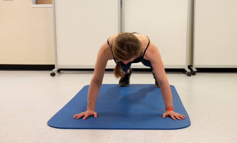 In press up position, hands set&nbsp;outside two lines 36 inches apart&nbsp;(91.4cm).