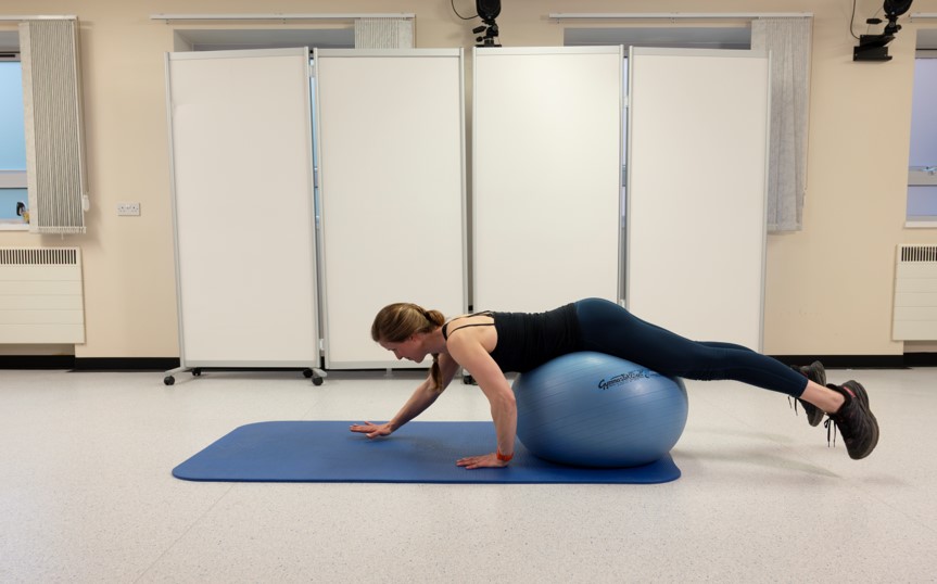 Slowly roll onto the ball so the hip rolls under your abdomen.