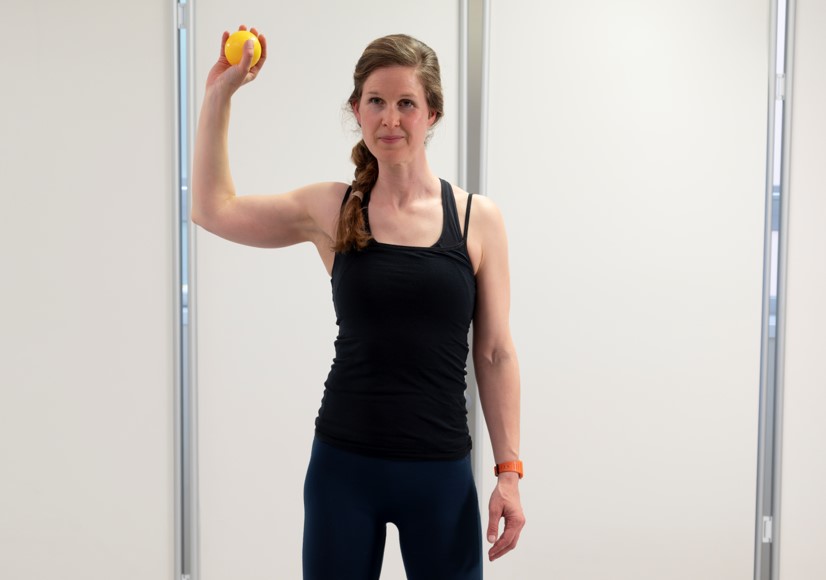 Standing with your feet hip width apart, drop and catch ball/ light weight with the arm straight out, slightly in front.