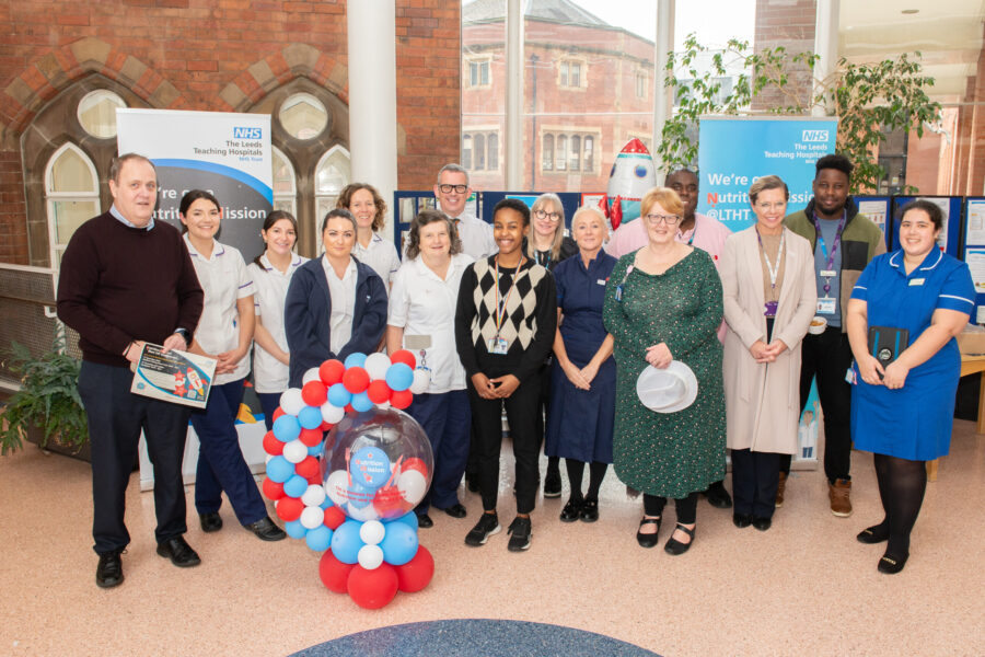 people stood in front of nutrition mission blast off roadshow stall