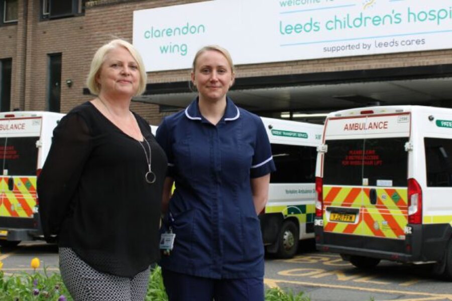 Two members of staff outside the Leeds Children's Hospital