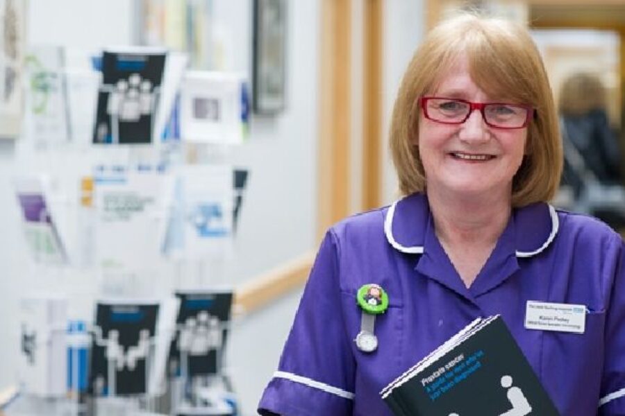 A member of smiling clinical team on a ward