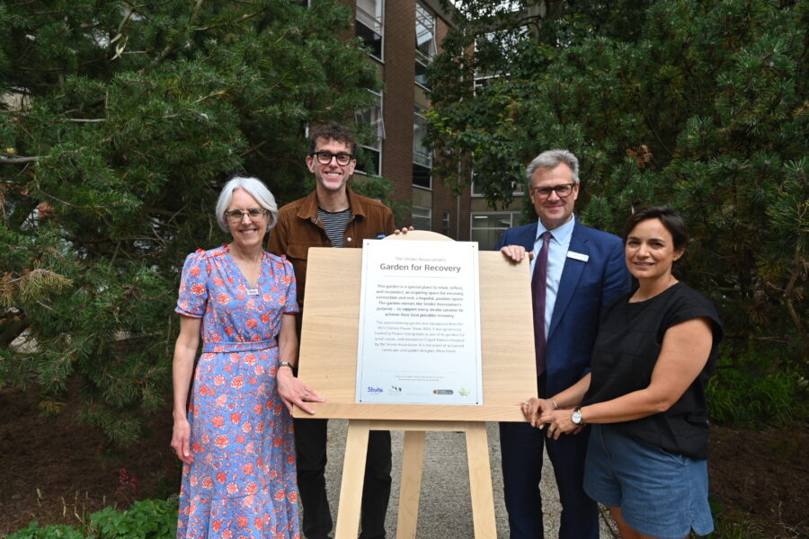 A group of four people including Chief Executive Phil Wood and Emmerdale actor Mark Charnock unveil a plaque in the new Stroke Association Recovery Garden at Chapel Allerton.