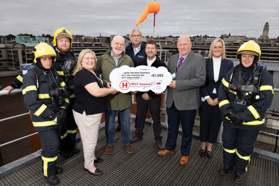 People including staff and visitors from the Help Appeal pictured on the Helideck with cheque being presented for £61,063
