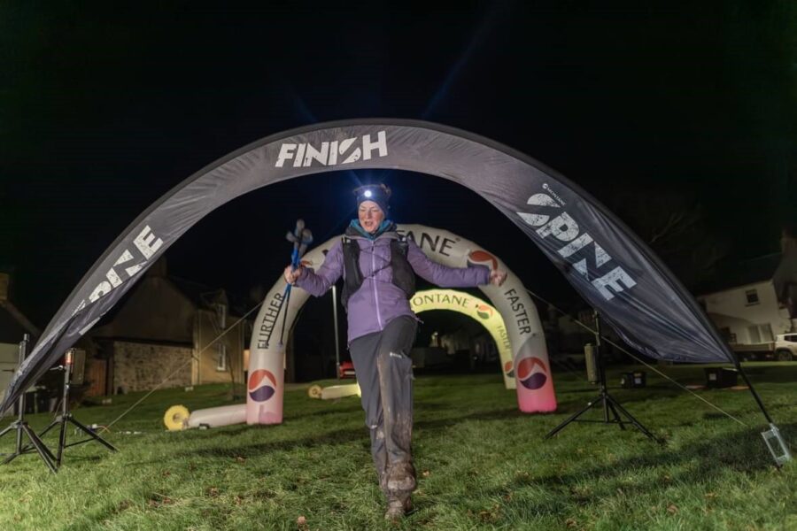 Mel crossing the finish line of the Spine Race