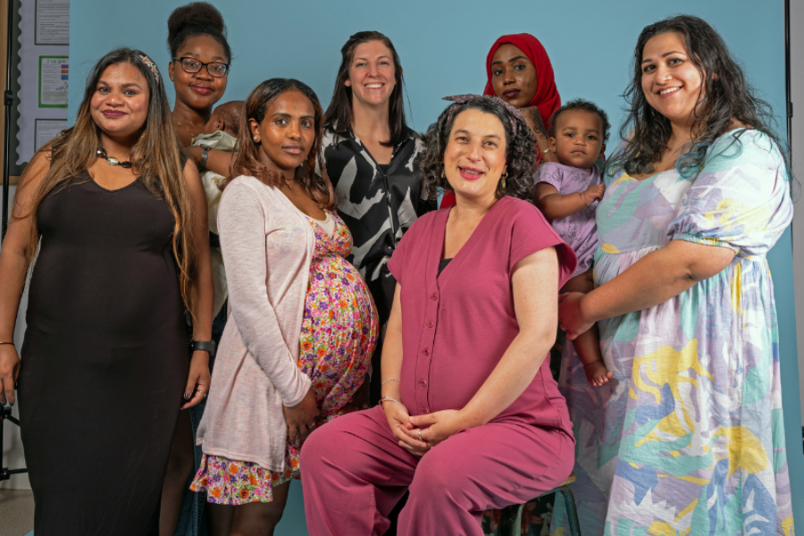 Group of 7 women looking at the camera at a photo shoot