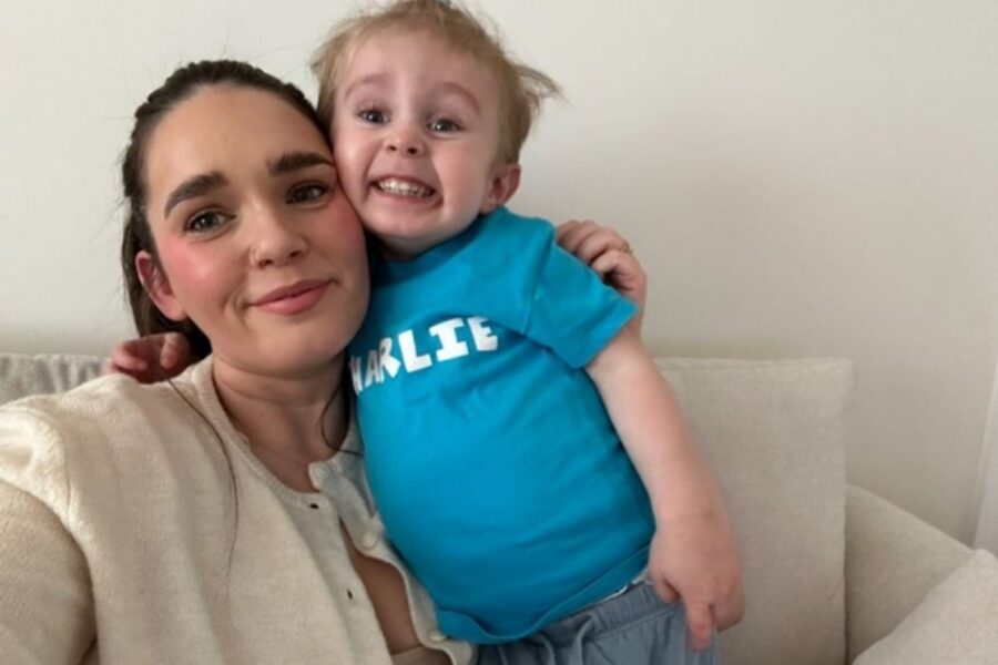 Mum Sophie holding toddler Charlie