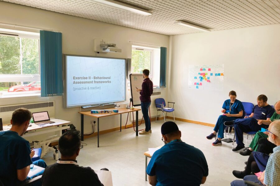 An image of the Melo ap being presented to staff.