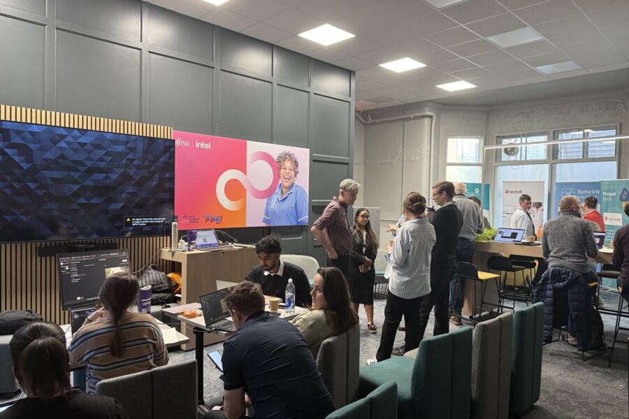 An image of the hackathon at the Innovation Pop Up with participants discussing the issues with each other.