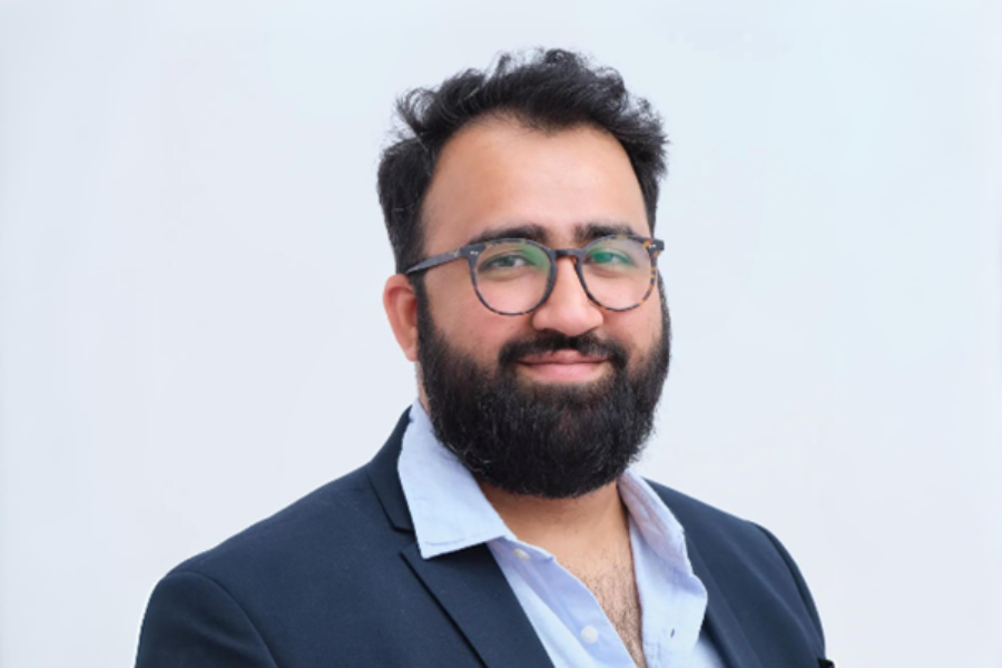 A professional headshot style image of Haris Shuai, CEO of Newton's Tree