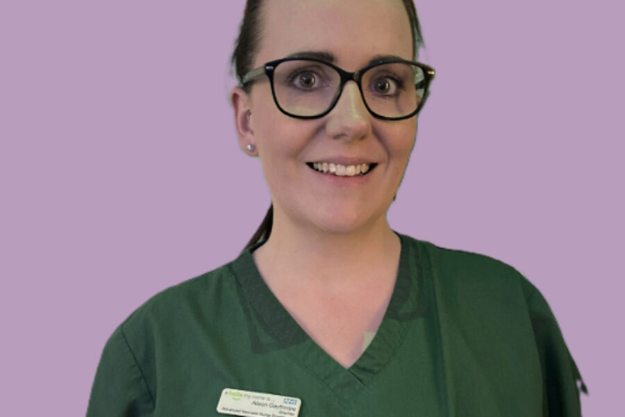 Picture of Alison in clinical green uniform